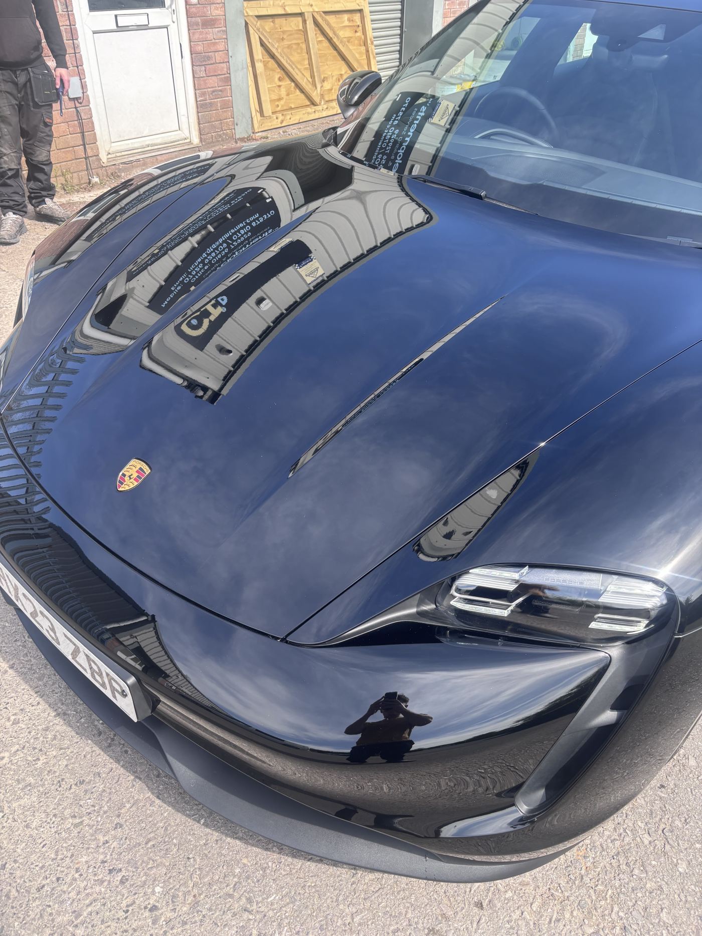 Gloss black Porsche Taycan after ceramic coating in Bridgend